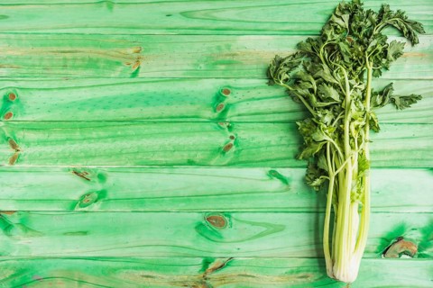 High angle view fresh celery green wooden background