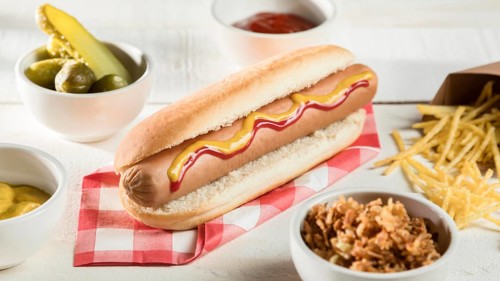High view hot dog with cheese condiments