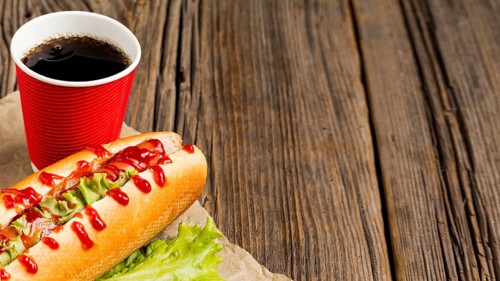 Hot dog with soda copy space