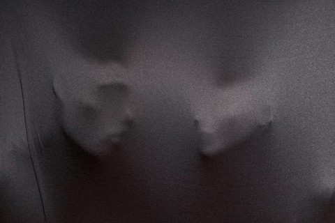 Imprints human faces gray cloth