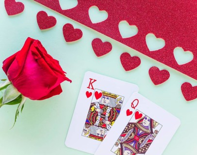 King queen hearts playing cards with rose