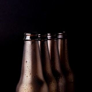 Line black beer bottles