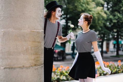 Male mime giving flower female mime