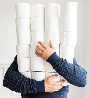 Man with stack toilet paper