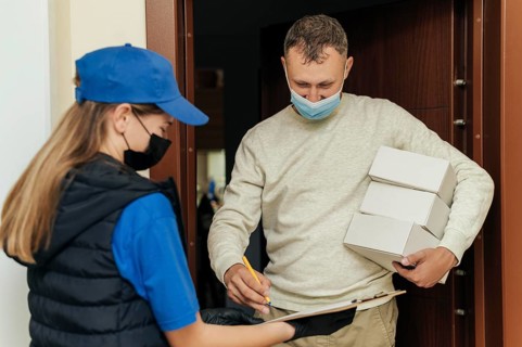 Medium shot man receiving boxes