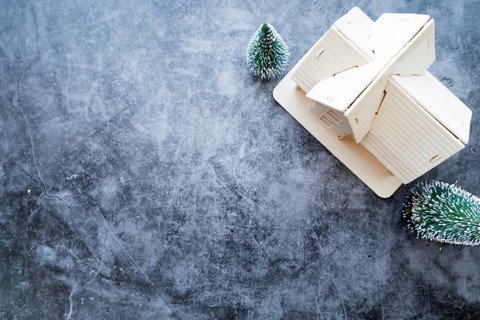 Overhead view house model with christmas tree weathered concrete background