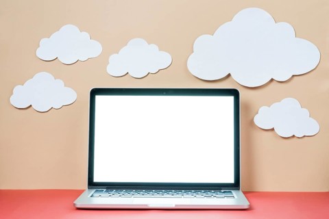 Paper clouds laptop