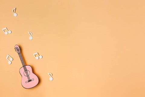 Pink guitar with white musical notes
