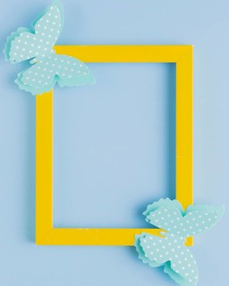 Polka dotted butterfly yellow border frame blue background