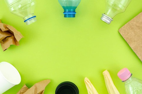 Top view colorful tableware green background