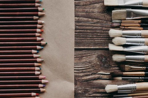 Top view crayons brushes arrangement