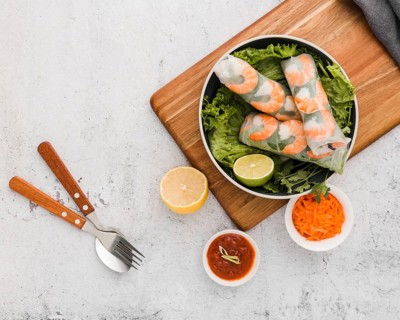 Top view fresh shrimp rolls bowl with sauce