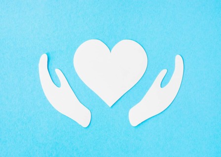 Top view paper heart with paper hands