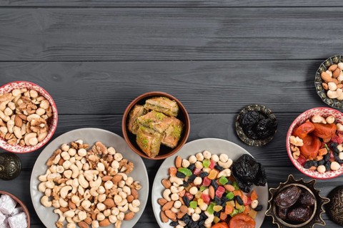 Traditional arabic ramadan baklava dried fruits nuts served wooden table