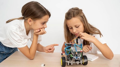 Two girls doing science experiments together