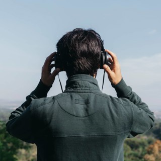 Unrecognizable man listening music