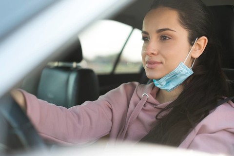 Woman car use properly mask