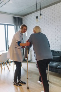 Woman walking with nurse retirement home