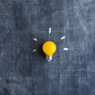 Yellow light bulb chalkboard