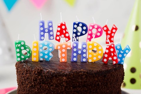 Assortment with birthday chocolate cake candles