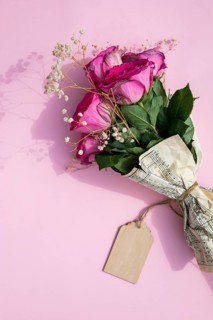 Bouquet roses wrapped music sheet