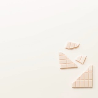 Broken chocolate bar isolated white background
