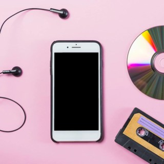 Cellphone with earphone disc cassette pink background