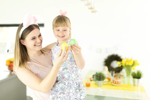 Cheerful woman girl with eggs