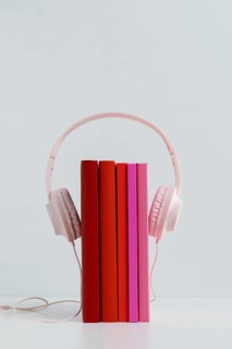 Colorful books with pink headphones