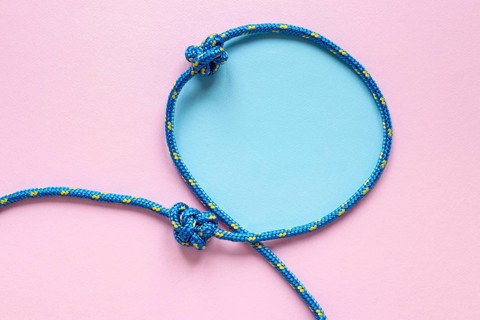 Copy space blue rope knot loop