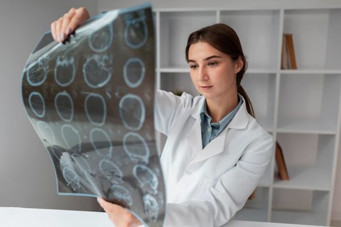 Doctor checking patients x ray