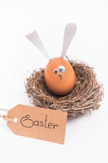 Easter inscription with egg with bunny ears nest