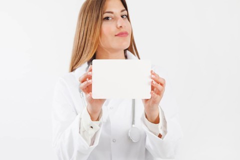 Female doctor showing paper