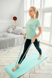 Female working out mat with elastic band