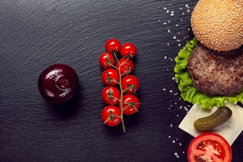 Flat lay burger ingredients slate background