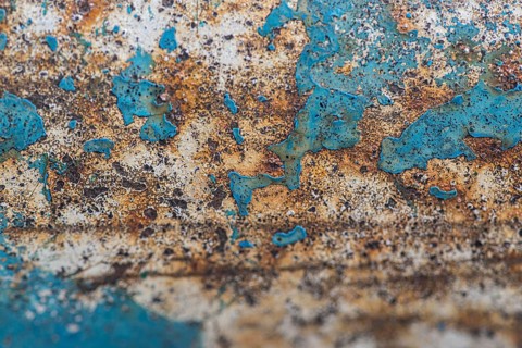 Flat lay rusty metal surface with paint peel