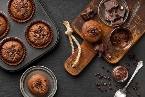 Flat lay tasty muffin with chocolate chocolate chips