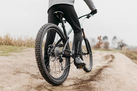 Full shot man riding bike 3