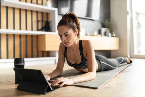 Full shot woman mat with tablet