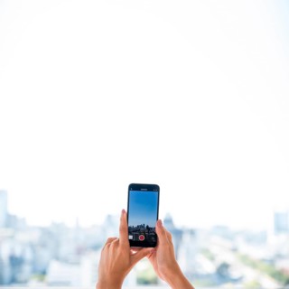 Girl taking picture landscape