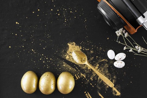 Golden eggs near spoon camera
