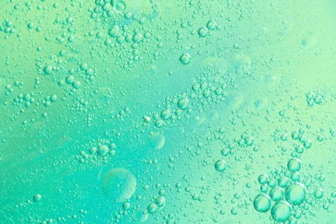 Green airy water bubbles glowing drops