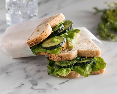 High angle sandwiches with greens cucumber