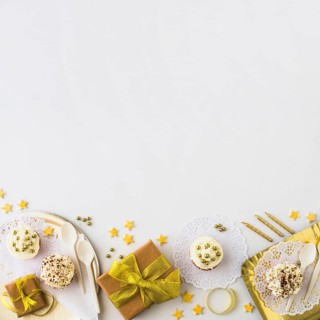 High angle view muffins gifts edge white backdrop