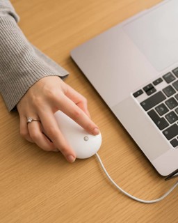 High angle woman laptop using mouse
