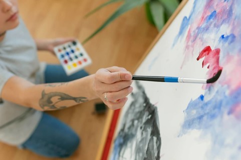 High view person creating painting