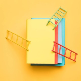 Ladders leaning stack colorful books