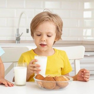 Little boy drinking milk