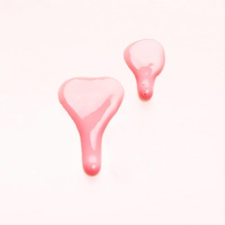 Pink nail polish drops sample isolated white surface