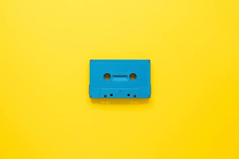 Radio concept with cassette yellow background